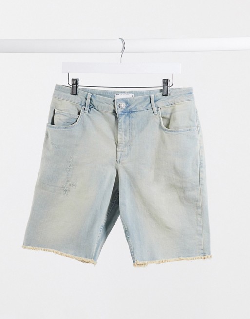 ASOS DESIGN slim denim shorts in light wash blue with distressing and raw hem