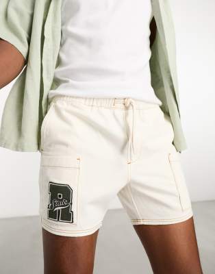 ASOS DESIGN slim shorter length denim cargo shorts with patch in ecru-Neutral