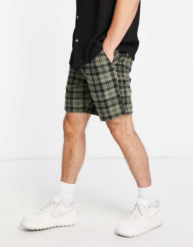 ASOS DESIGN slim shorts in green plaid cord