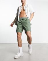 ASOS DESIGN slim shorts in mid length in khaki 