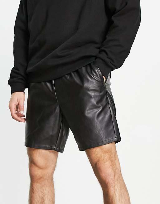 Man in 2025 leather shorts