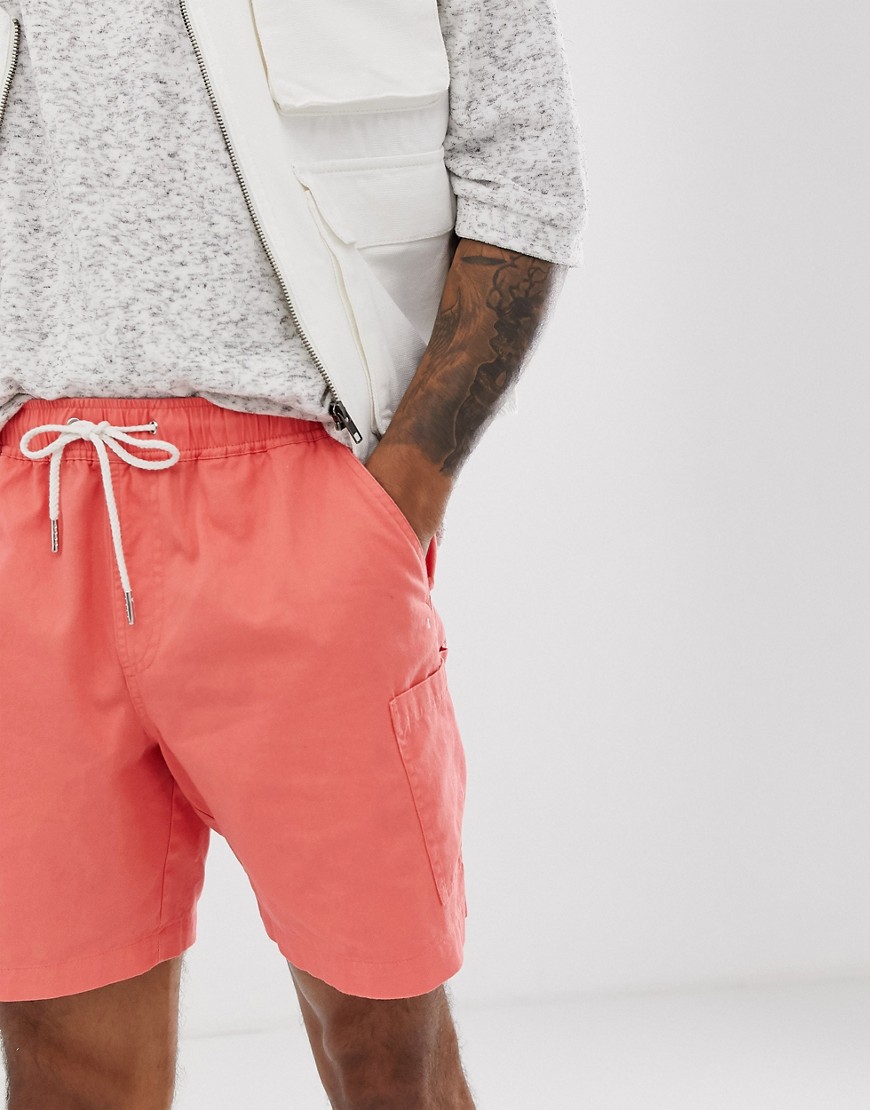 ASOS DESIGN slim shorts in washed pink with cargo pocket