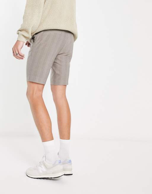 ASOS DESIGN pleated shorts in mid length in tan