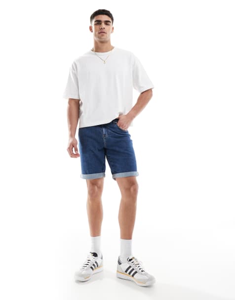 ASOS DESIGN slim stretch denim shorts in mid wash blue - view 1