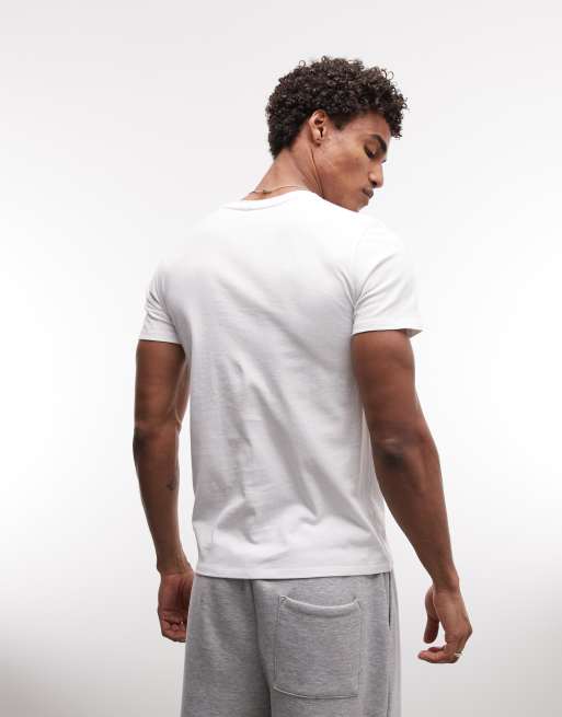 ASOS DESIGN slim t-shirt with puff print soccer graphic in white, 5 of 5