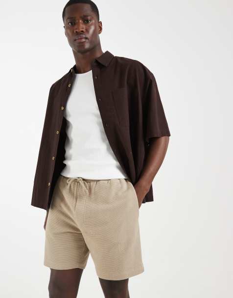 ASOS DESIGN slim textured fit jersey shorts in beige - view 1