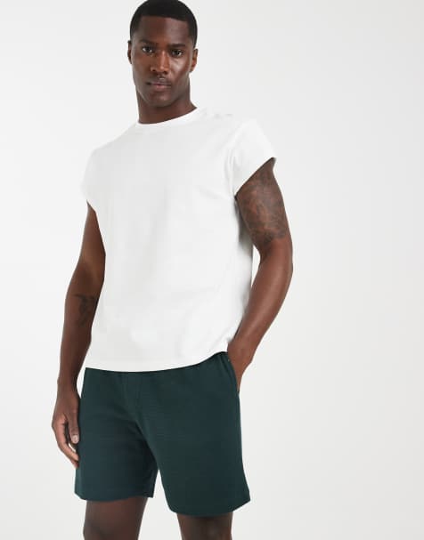 ASOS DESIGN slim textured fit jersey shorts in green - view 1