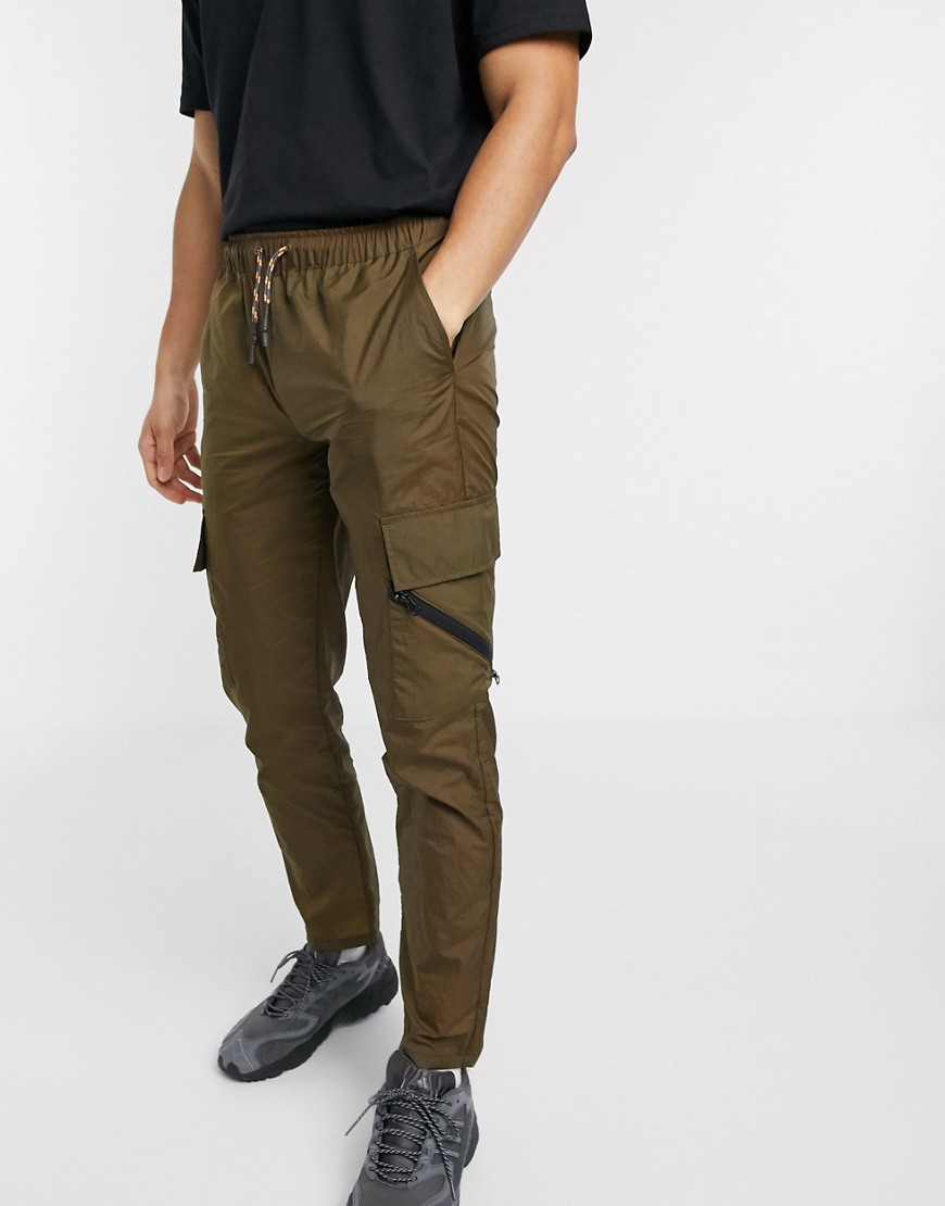 ASOS DESIGN slim trousers in nylon with elastic waist and contrast trims-Green