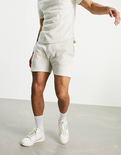 ASOS DESIGN slim waffle shorts with piping in cream - part of a set