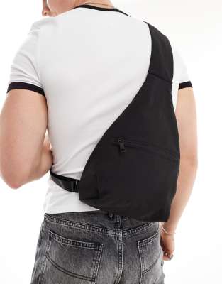 sling backpack with front pocket in black