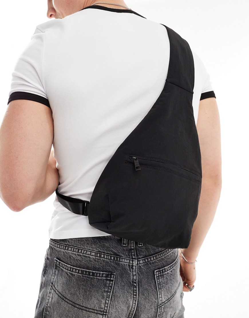 ASOS DESIGN sling bag with front pocket in black