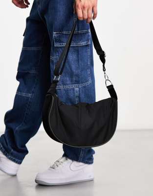 ASOS DESIGN SLING BAG WITH PIPING IN BLACK 
