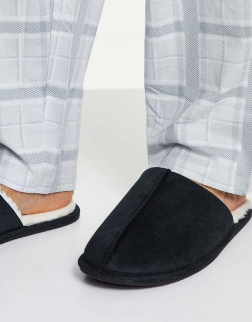 ASOS DESIGN slip on slippers in black with cream faux fur lining