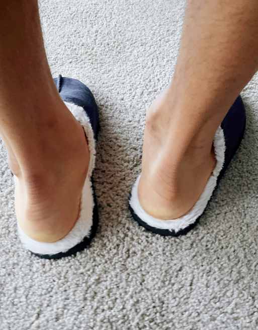 ASOS DESIGN slip on slippers in navy with cream faux fur lining