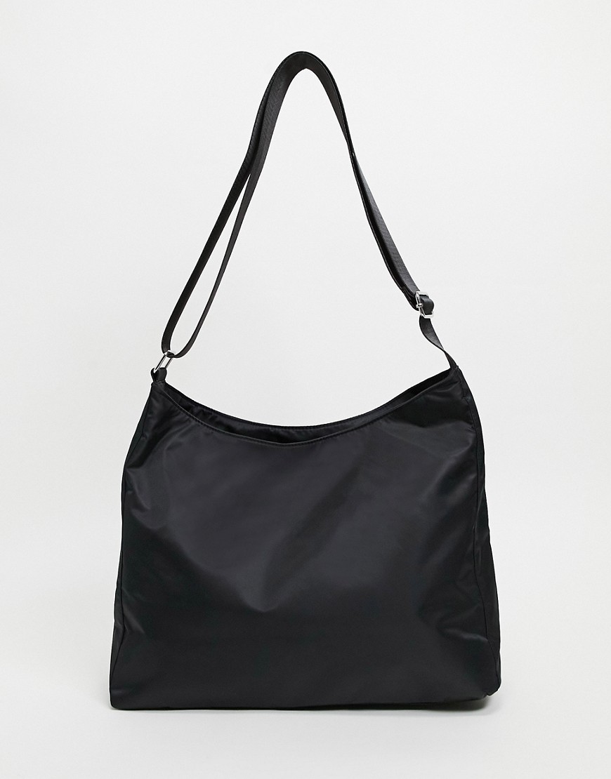 ASOS DESIGN slouchy cross body saddle bag in black nylon