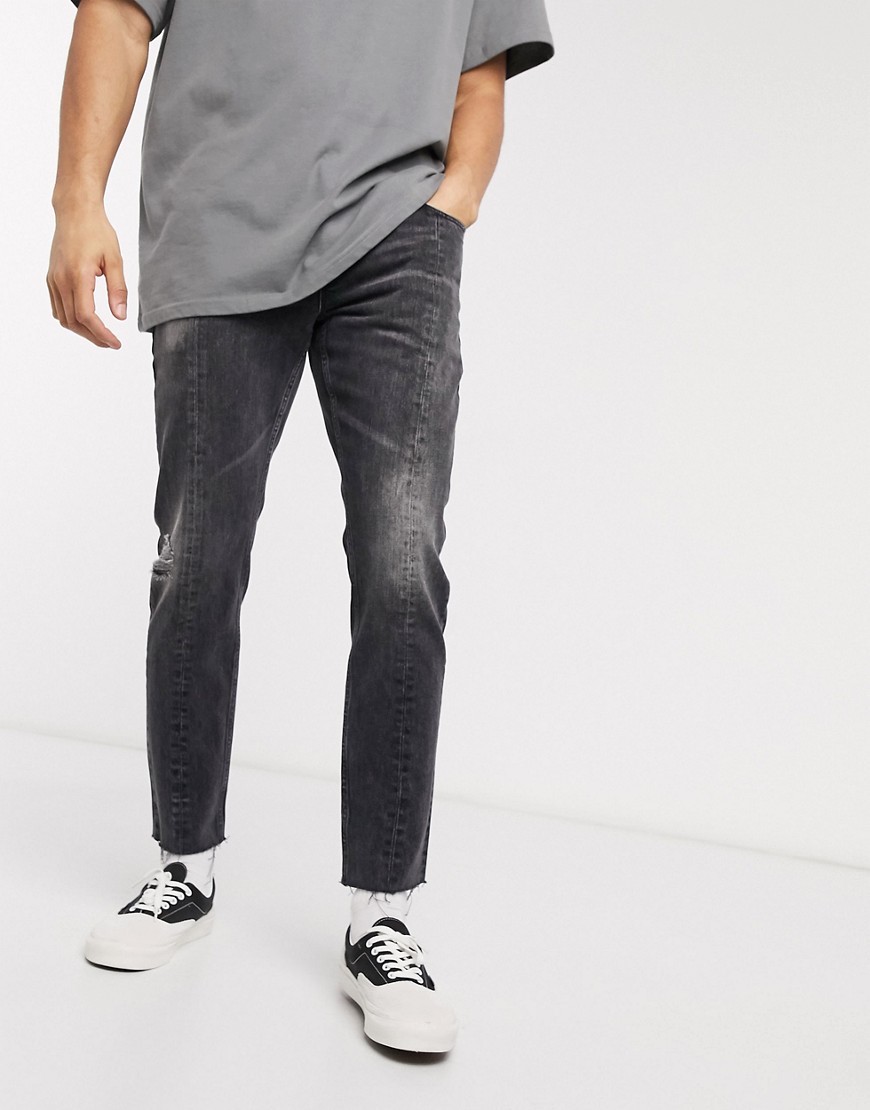 ASOS DESIGN - Smalle jeans met onafgewerkte zoom en naden in zwart met wassing