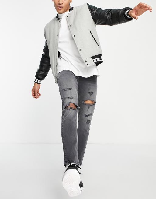 ASOS DESIGN - Smalle jeans met stretch en hevige scheuren in zwarte wassing