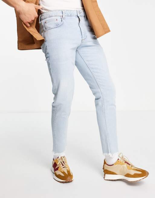 ASOS DESIGN - Smalle jeans met stretch en onafgewerkte zoom in vintage lichte wassing