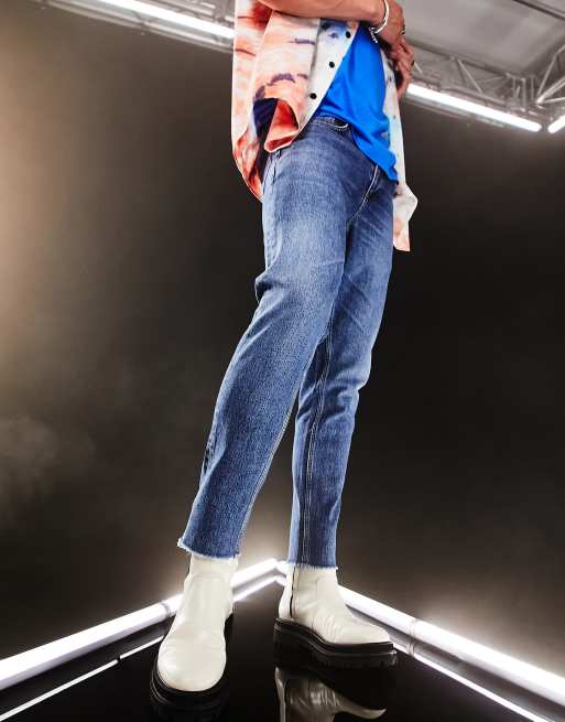 ASOS DESIGN - Smalle jeans met stretch en onafgewerkte zoom in vintage medium wassing