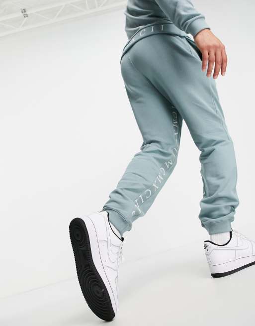 ASOS DESIGN - Smaltoelopende joggingbroek met bies met Romeinse cijfers aan de binnenkant van het been in blauwgrijs, deel van co-ord set