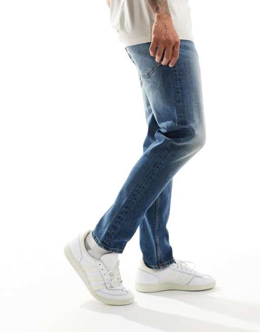 ASOS DESIGN - Smaltoelopende stretchjeans in vintage mid-wash blauw