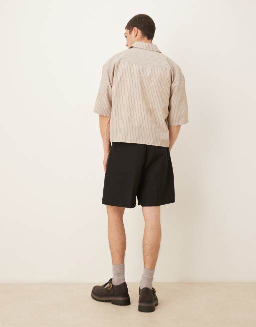 ASOS DESIGN smart bermuda shorts with front pleat and belt detail in black 