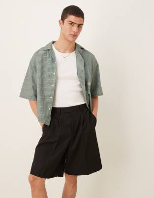 ASOS DESIGN wide leg dressy shorts with front pleats in black