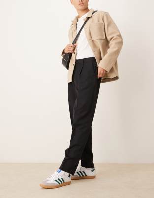 ASOS DESIGN smart oversized tapered trousers with front pleat in black - view 1