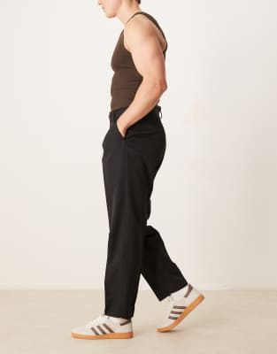 ASOS DESIGN smart oversized tapered trousers with front pleat in black - view 1