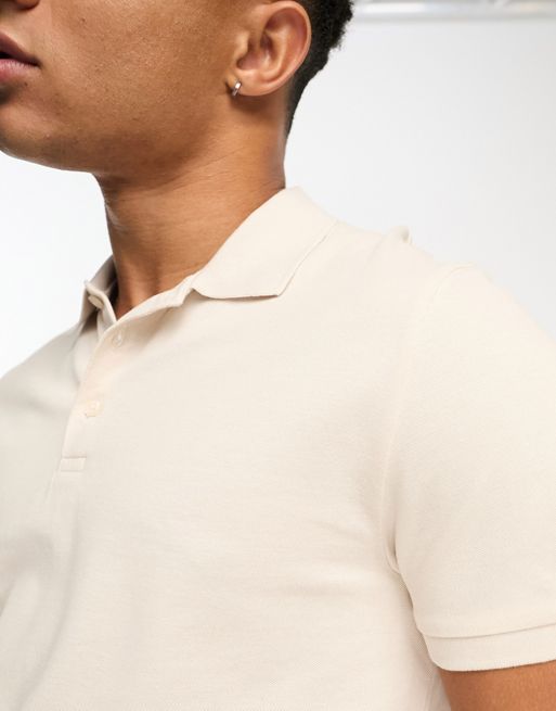 Stussy Heavy Pique Long Sleeve Polo Shirt With Logo Collar, $84, Asos