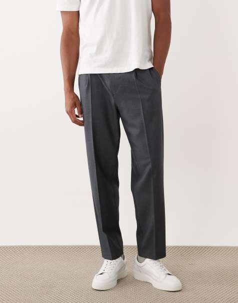 ASOS DESIGN smart pleated denim look relaxed tapered trousers in dark blue - view 1