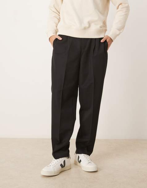 ASOS DESIGN smart pleated relaxed tapered pants and elasticated waistband in black - view 1