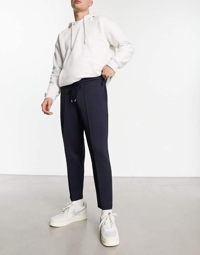 ASOS DESIGN smart tapered sweatpants in navy scuba