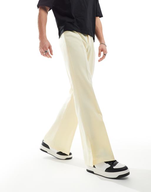 ASOS DESIGN smart vintage flare trousers with side split in yellow ASOS