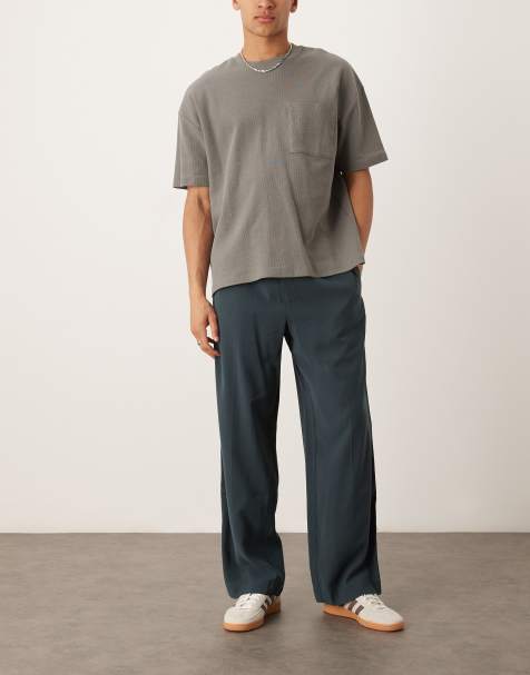 ASOS DESIGN smart wide leg pants in dark blue with elasticated waist and side stripes - view 1