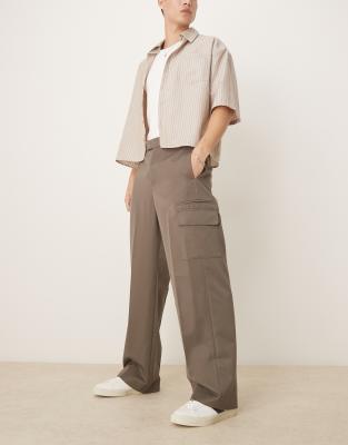 asos ASOS DESIGN smart wide leg trousers with double pleats and cargo pockets in khaki with elasticated waist