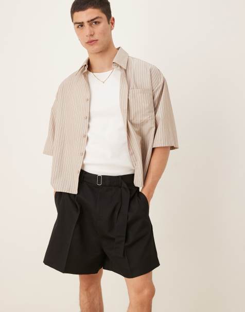ASOS DESIGN smart wide longline shorts with front pleat and belt detail in black - view 1