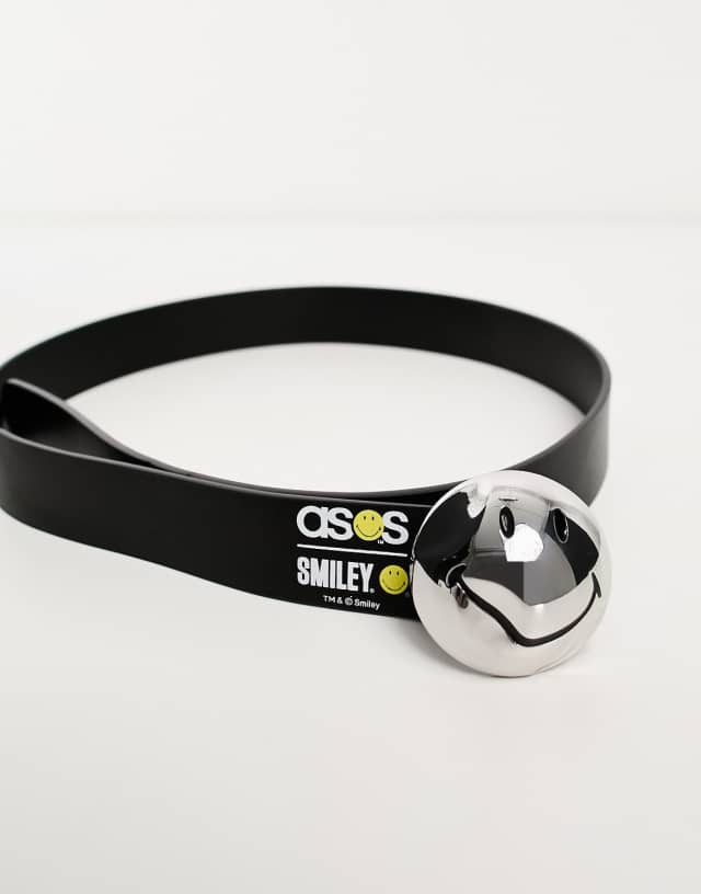 ASOS Design Smiley Collab faux leather belt with warped buckle in black