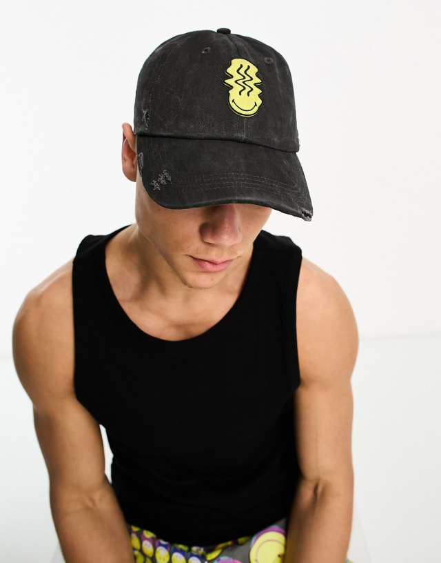 ASOS DESIGN Smiley Collab soft baseball cap with rubberized logo in distressed black