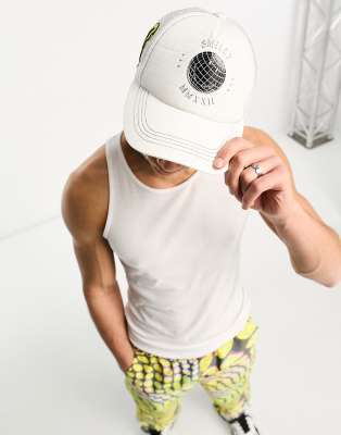 ASOS Design Smiley Collab trucker cap with logo and contrast yellow peak in  white