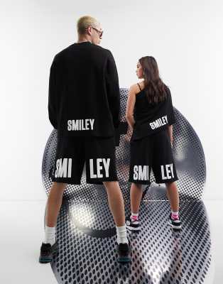 ASOS DESIGN Smiley Collab unisex short with Smiley print in black - ASOS Price Checker