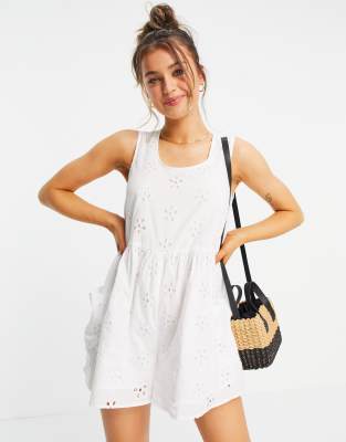ASOS DESIGN smock sleeveless textured rompers with pockets in white broderie
