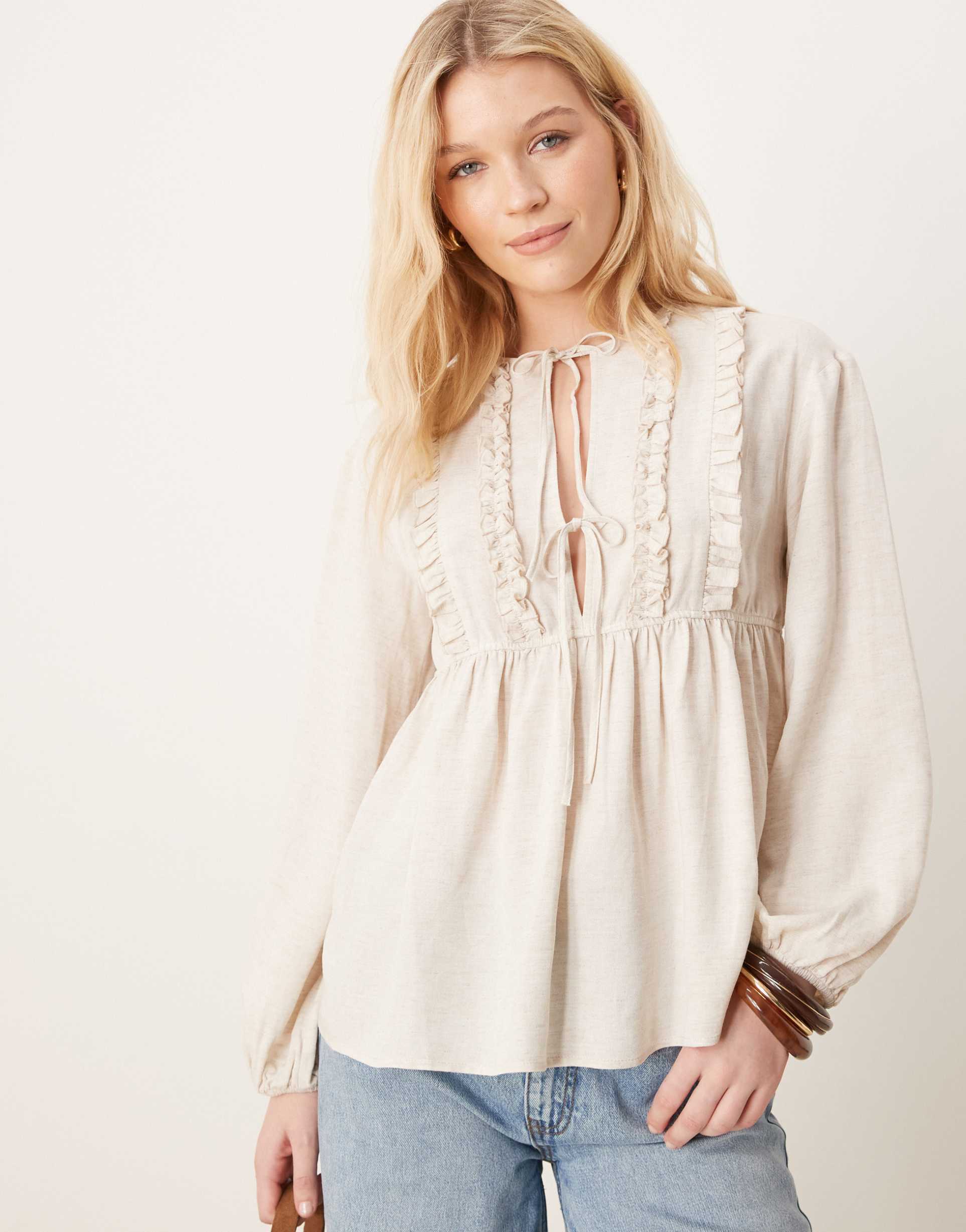 asos design smock top with ruffle detail and tie neck in natural