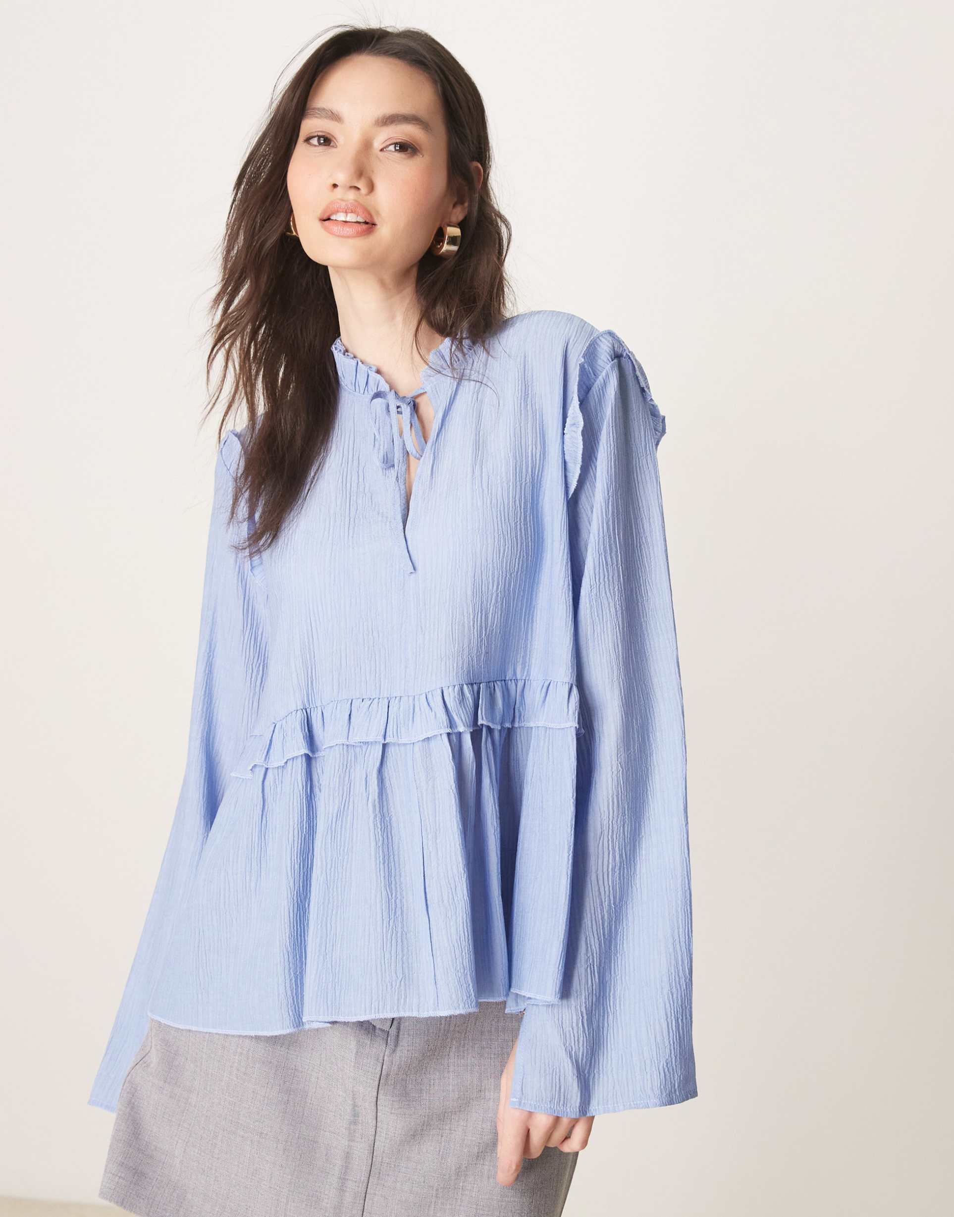 asos design smock top with tie neck and frill detail in blue