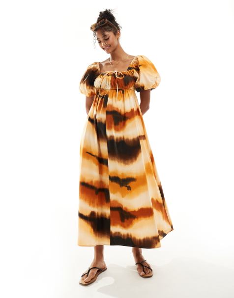 ASOS DESIGN – Smockad midiklänning med puffärmar och abstrakt mönster - view 1