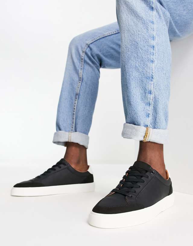 ASOS DESIGN sneakers in black with faux suede panels