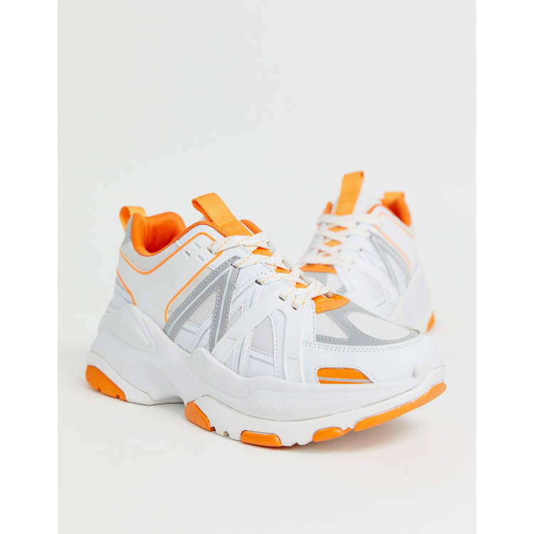 Shoes orange sole deals