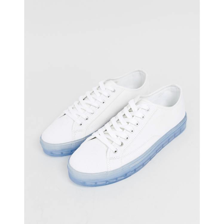 ASOS DESIGN sneakers in white with translucent blue sole