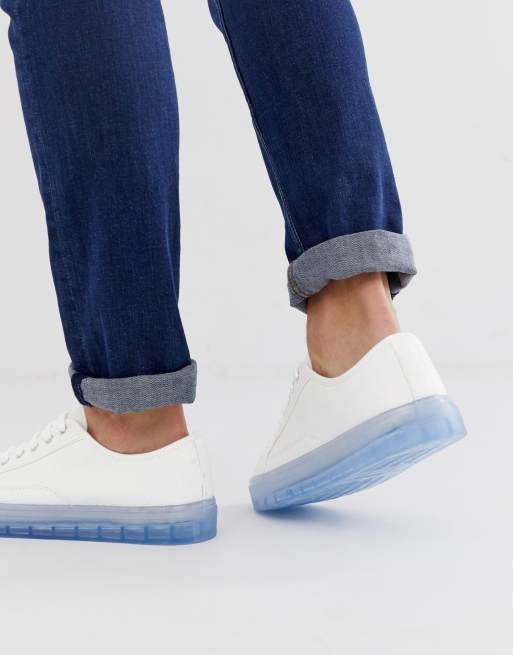 ASOS DESIGN sneakers in white with translucent blue sole