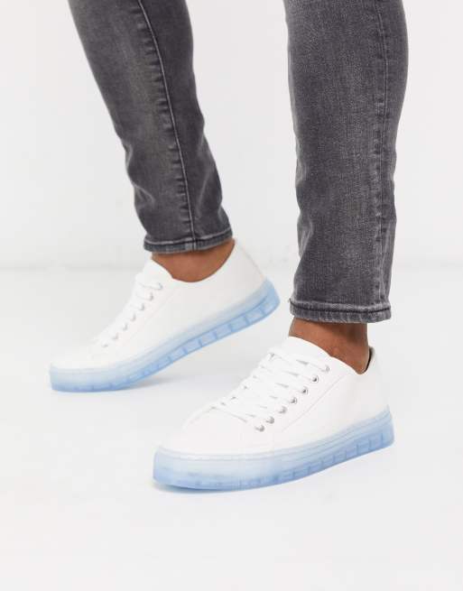 ASOS DESIGN sneakers in white with translucent blue sole